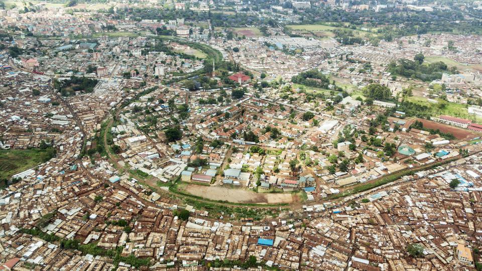 This is one of the largest slum are in the world. The government is trying to construct housing outside the slum for the inhabitans some are seen at the outer margin of the slum area.See also my LB: